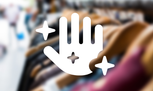 An image of a hand raised palm forward surrounded by stars to symbolise magic overlayed on a blurred image of clothes rail in a charity shop