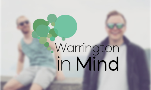 a blurred image of two smiling young men overlayed with the Warrington in Mind logo which is the words with different sized circles in shades of green arranged to resemble a brain